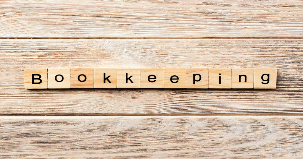 bookkeeping written with scrabble tiles